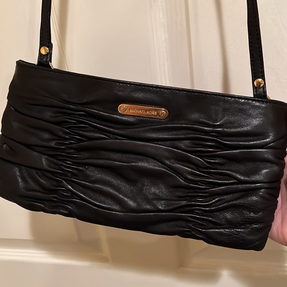 Michael Kors black leather wallet on a chain